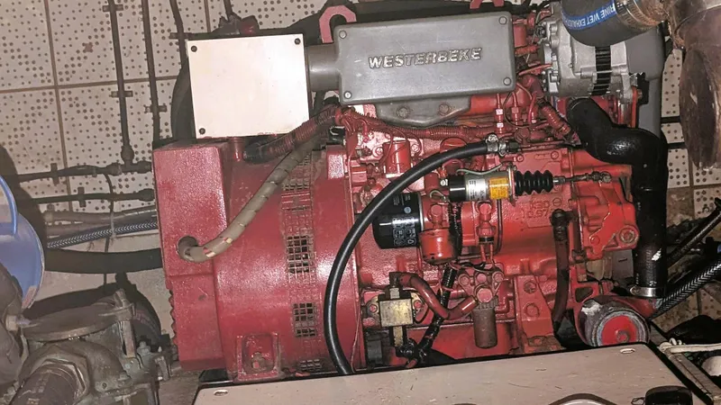 Slide: The Image of Engine of 1986 Heritage East 40 Sundeck boat, featuring a red Westerbeke motor. - 56