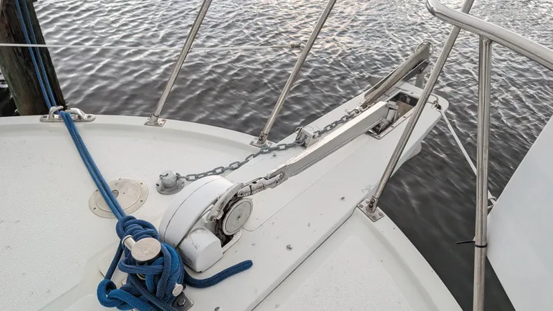 Slide: The Image of Bow of 1986 Heritage East 40 Sundeck yacht with anchor and blue rope. - 9
