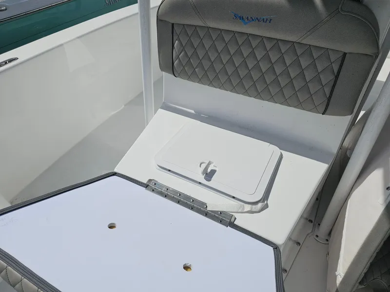 Slide: The Image of Savannah SS21 2025 boat seat with storage compartment, featuring diamond-patterned upholstery. - 16