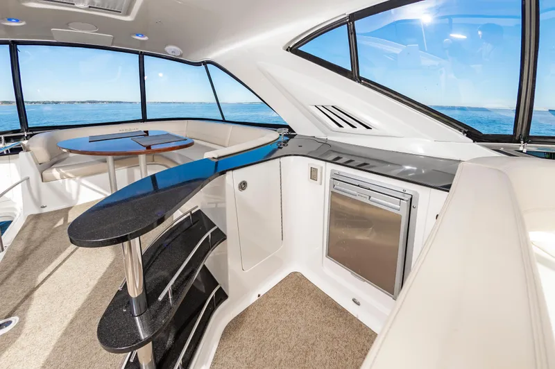 Slide: The Image of Interior of 2011 Meridian 541 Sedan yacht with modern seating and ocean view. - 10