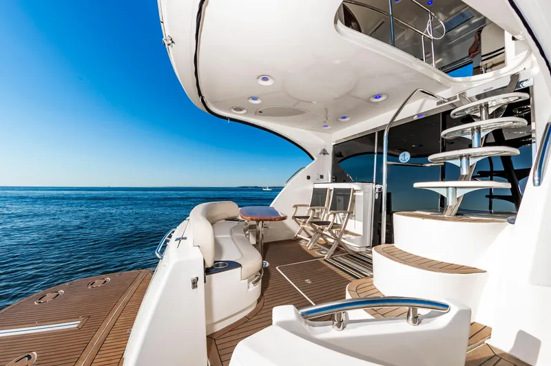 Slide: The Image of Luxurious 2011 Meridian 541 Sedan yacht deck with ocean view and spiral staircase. - 11