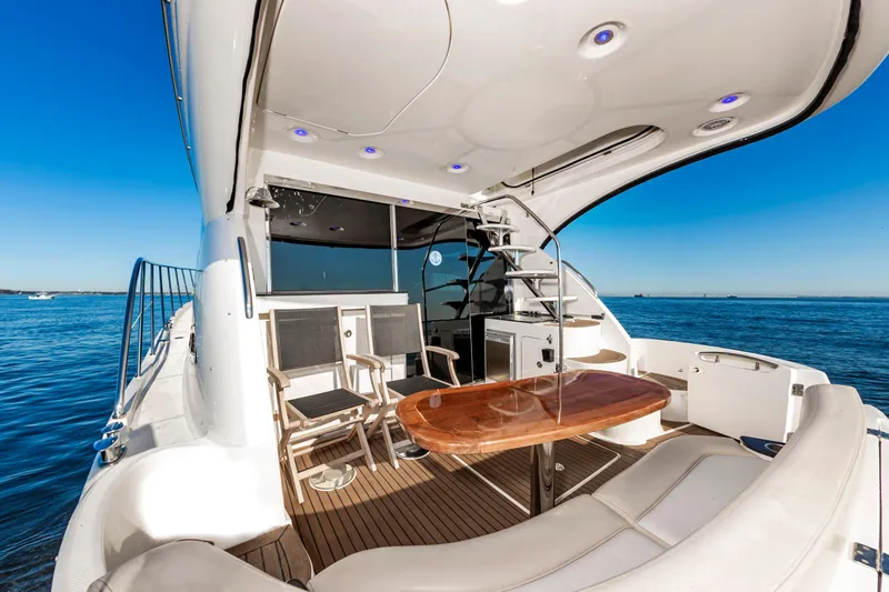 Slide: The Image of 2011 Meridian 541 Sedan yacht with elegant deck seating and ocean view. - 12