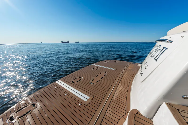 Slide: The Image of 2011 Meridian 541 Sedan yacht deck overlooking serene ocean view. - 16