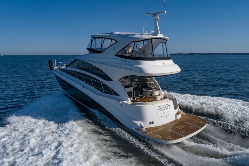 Slide: The Image of 2011 Meridian 541 Sedan yacht cruising on open water. - 2
