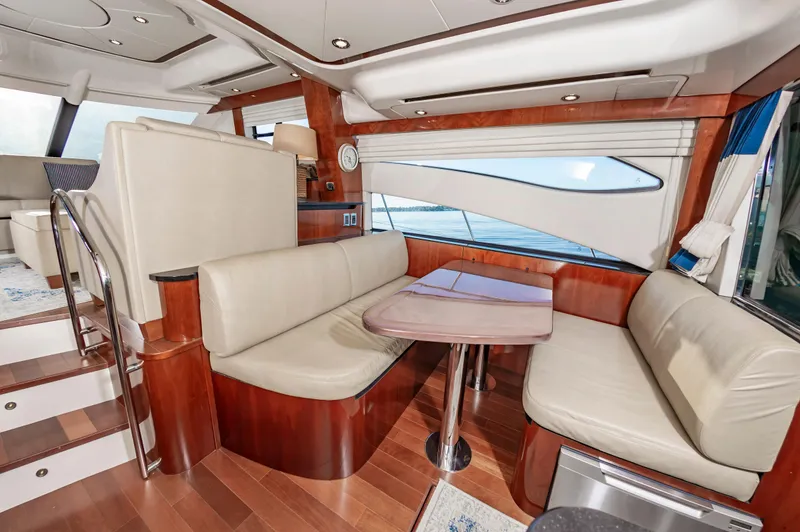 Slide: The Image of Luxurious interior of 2011 Meridian 541 Sedan yacht with elegant seating and wooden finishes. - 21