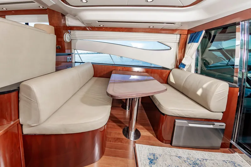 Slide: The Image of Luxurious interior of 2011 Meridian 541 Sedan yacht with elegant seating and wooden finishes. - 22