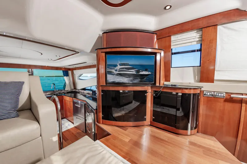 Slide: The Image of Luxurious interior of 2011 Meridian 541 Sedan yacht with modern amenities and elegant wood finishes. - 27