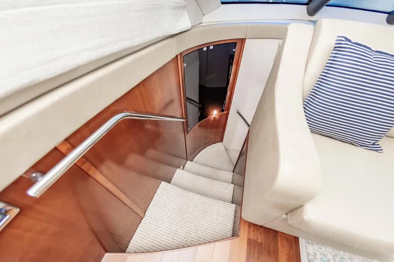 Slide: The Image of Interior staircase of 2011 Meridian 541 Sedan yacht with striped cushion. - 28