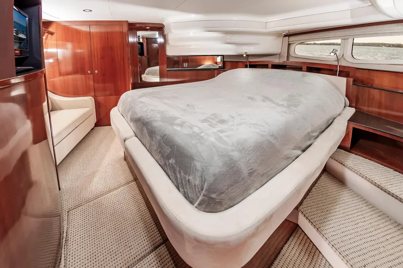 Slide: The Image of Luxurious bedroom interior of 2011 Meridian 541 Sedan yacht with elegant wood finishes. - 30