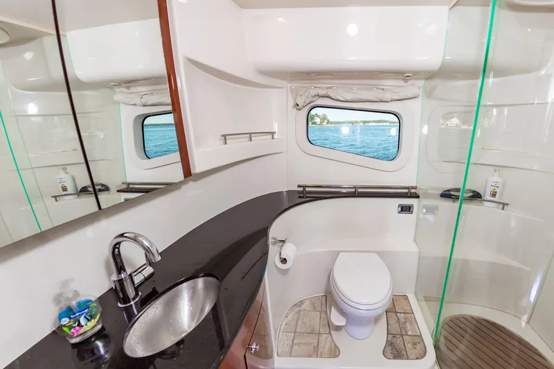 Slide: The Image of Luxurious bathroom interior of 2011 Meridian 541 Sedan yacht with ocean view window. - 33