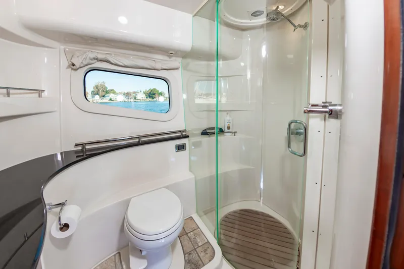 Slide: The Image of Luxurious bathroom in 2011 Meridian 541 Sedan yacht with shower and window view. - 34