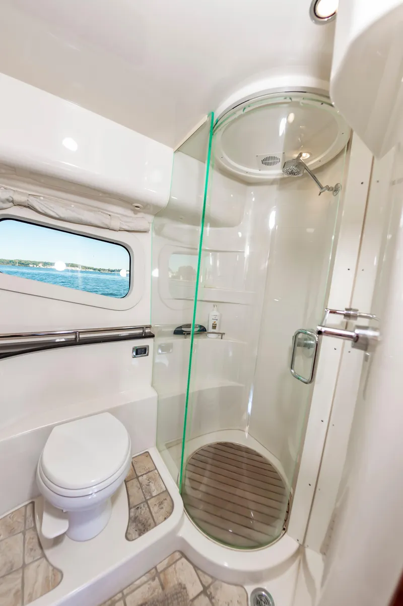 Slide: The Image of Luxurious bathroom in 2011 Meridian 541 Sedan yacht with modern shower and scenic window view. - 35