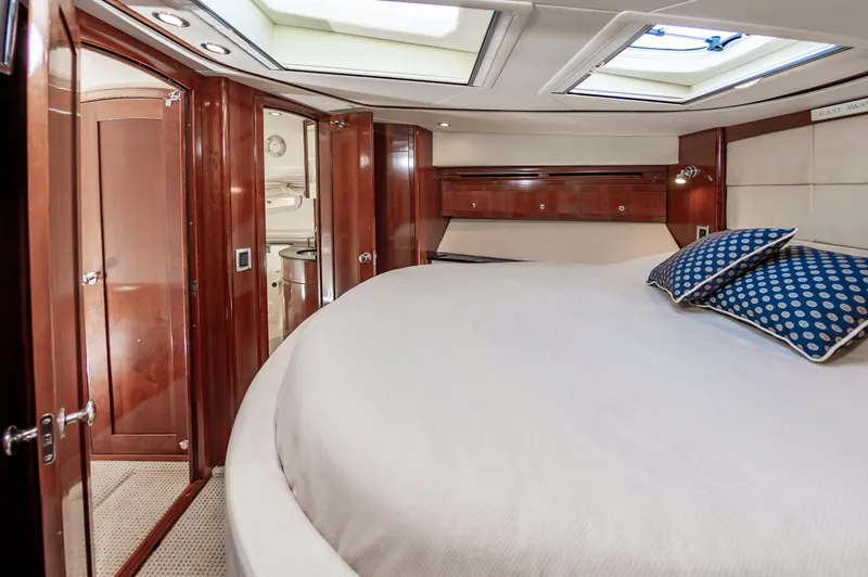 Slide: The Image of Luxurious interior of 2011 Meridian 541 Sedan yacht with elegant wood finish and skylights. - 38