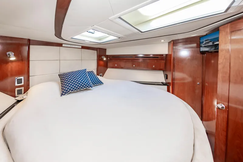 Slide: The Image of Luxurious bedroom interior of 2011 Meridian 541 Sedan yacht with skylight and wood paneling. - 39