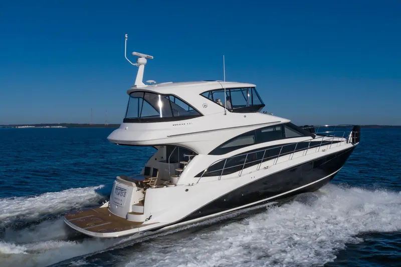 Slide: The Image of 2011 Meridian 541 Sedan yacht cruising on open water. - 4