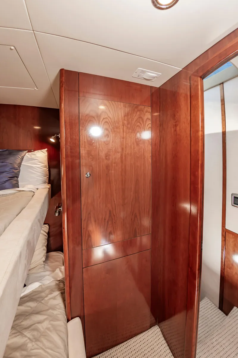 Slide: The Image of Interior cabin of 2011 Meridian 541 Sedan yacht with wooden paneling and bunk bed. - 49