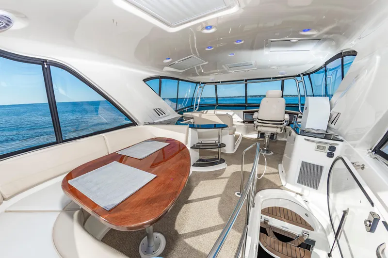 Slide: The Image of Luxurious interior of 2011 Meridian 541 Sedan yacht with ocean view and elegant seating. - 5
