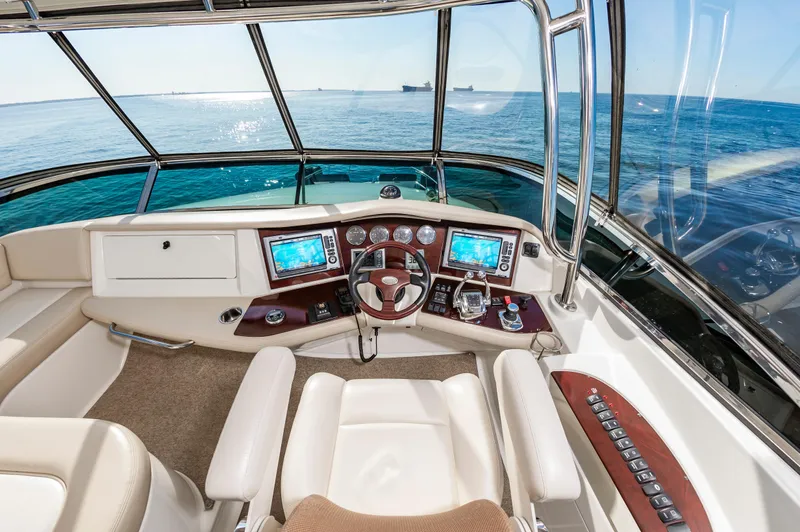 Slide: The Image of 2011 Meridian 541 Sedan yacht helm with navigation screens and ocean view. - 6