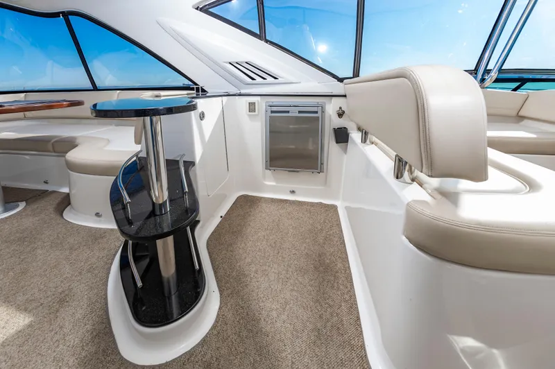 Slide: The Image of Interior of 2011 Meridian 541 Sedan yacht with modern seating and table. - 9