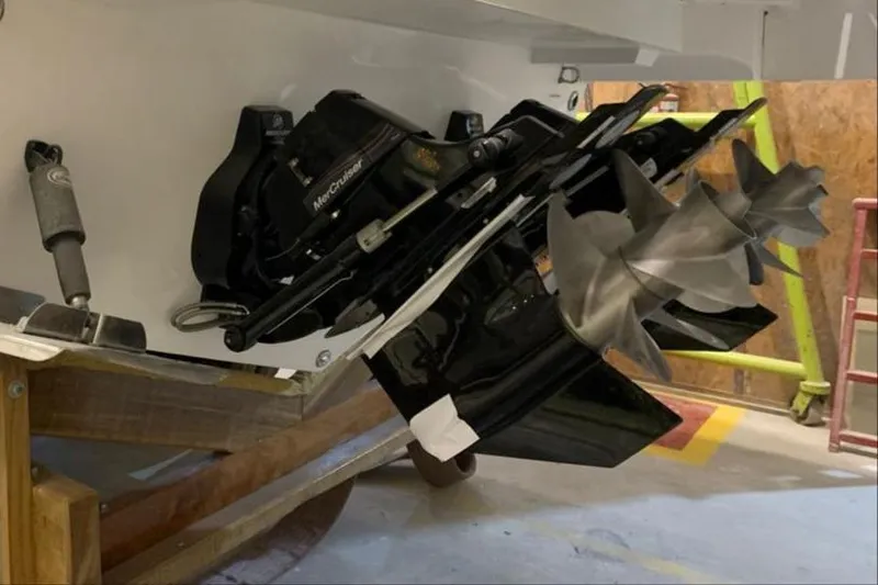 Slide: The Image of 2025 Hanover 377 Outboard engine with dual propellers in a workshop setting. - 19