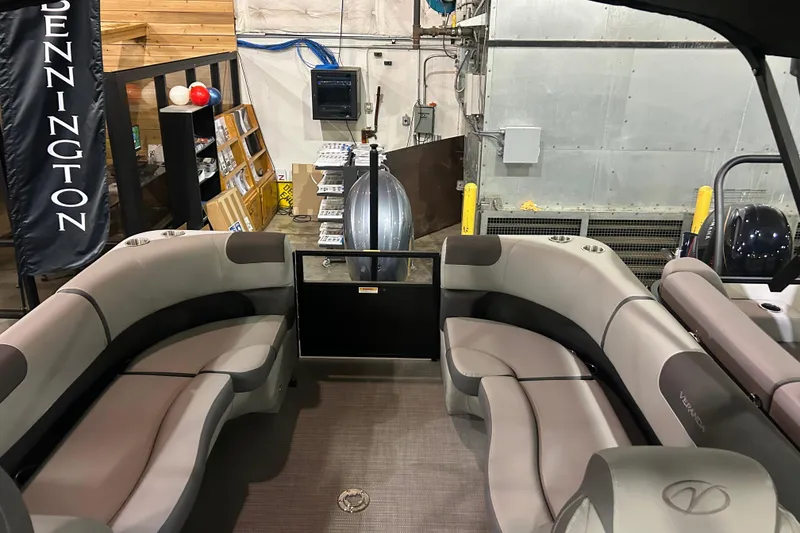 Slide: The Image of 2025 Veranda Relax VR22RC pontoon boat interior with plush seating in showroom. - 10