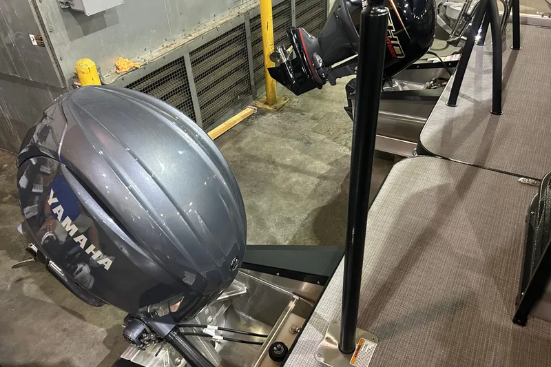 Slide: The Image of 2025 Veranda Relax VR22RC boat with Yamaha outboard motor in a garage setting. - 11