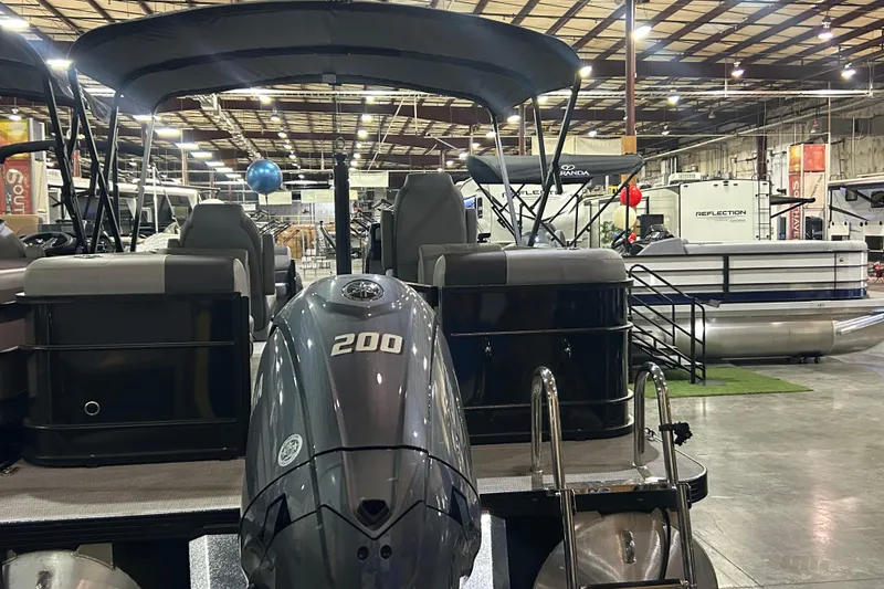Slide: The Image of 2025 Veranda Relax VR22RC pontoon boat with 200 HP engine in showroom. - 12