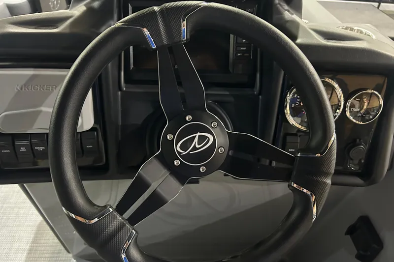 Slide: The Image of Steering wheel of 2025 Veranda Relax VR22RC boat with dashboard controls. - 6
