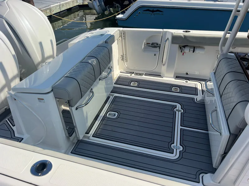 Slide: The Image of 2023 Pursuit S 288 Sport boat interior with sleek seating and modern design. - 36