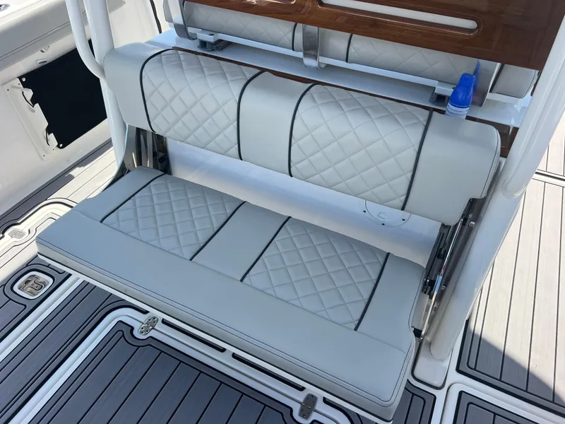 Slide: The Image of 2023 Pursuit S 288 Sport boat with cushioned seating and deck details. - 39