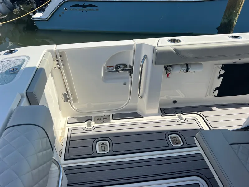 Slide: The Image of 2023 Pursuit S 288 Sport boat interior with sleek seating and modern deck design. - 40