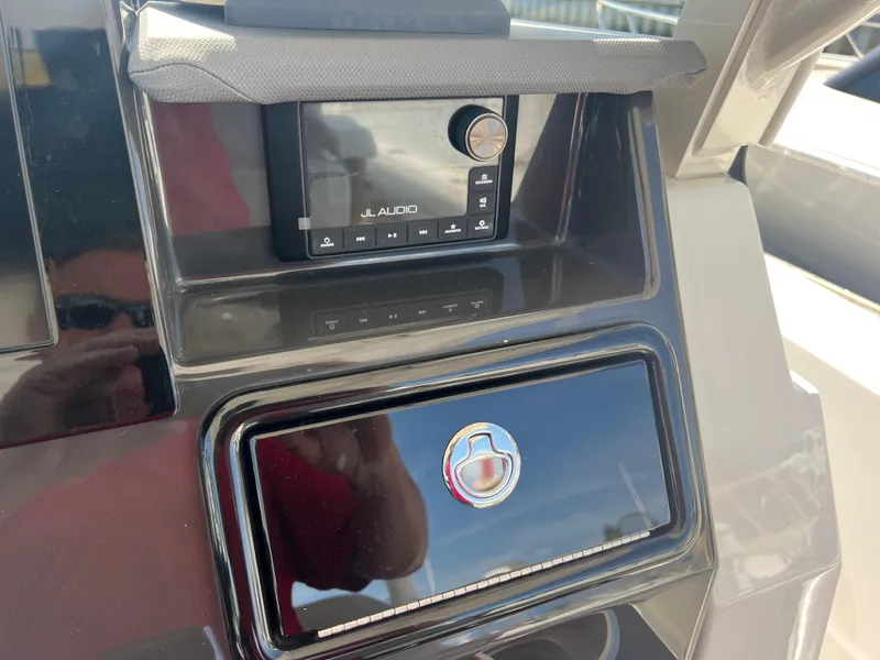 Slide: The Image of 2023 Pursuit S 288 Sport dashboard featuring JL Audio system. - 45