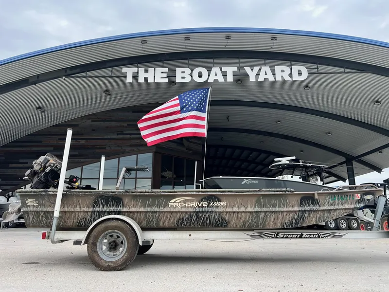 Slide: The Image of 2012 Pro-Drive 1854 boat with American flag at The Boat Yard. - 1
