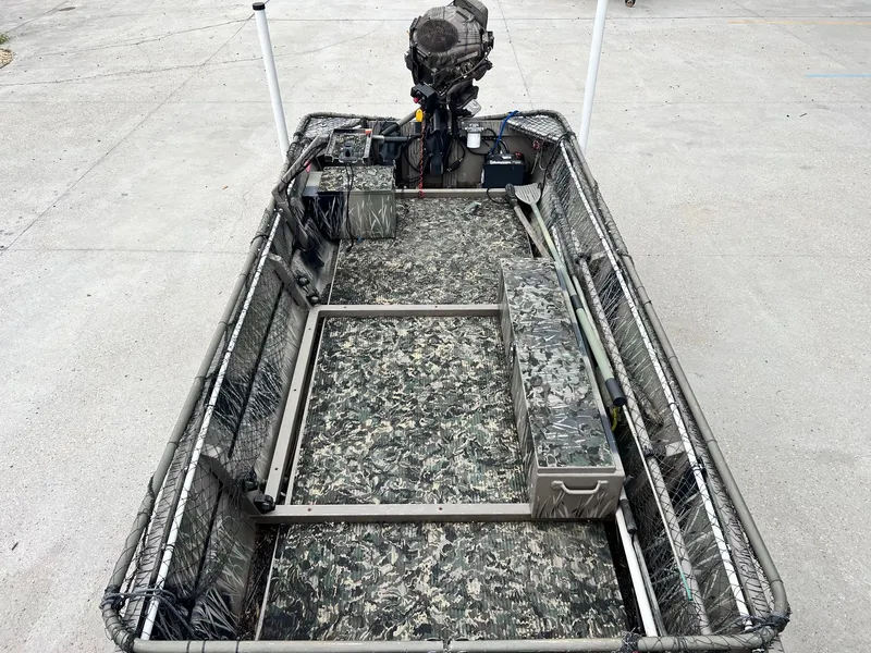 Slide: The Image of 2012 Pro-Drive 1854 boat with camouflage interior and outboard motor. - 8