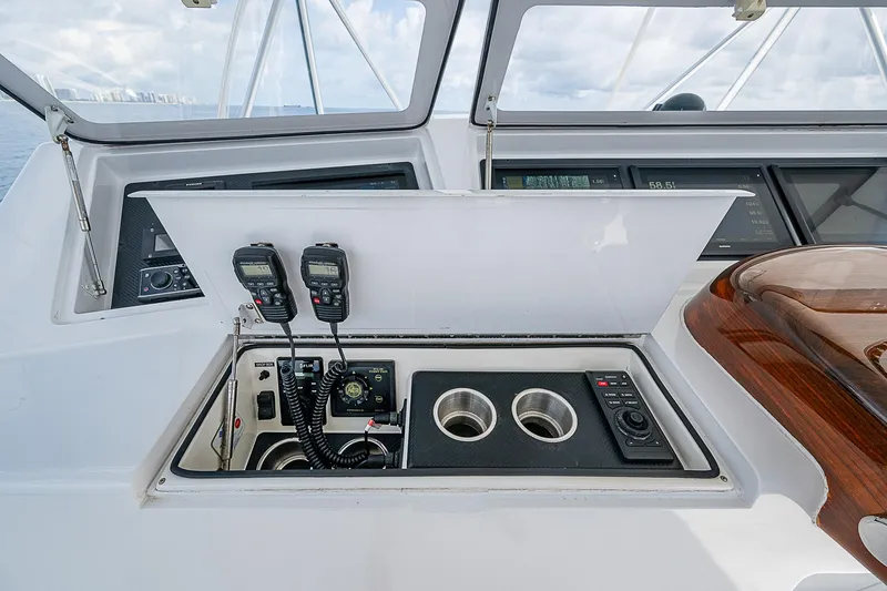 Slide: The Image of 2003 Viking Convertible yacht helm with communication equipment and control panel. - 18
