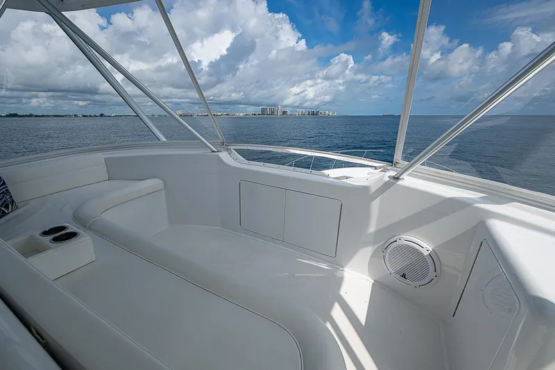 Slide: The Image of 2003 Viking Convertible yacht interior with ocean view and white seating. - 19