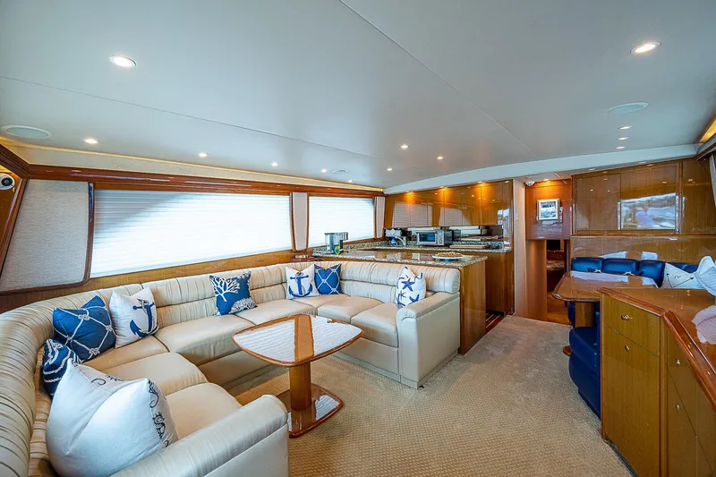 Slide: The Image of Luxurious interior of a 2003 Viking Convertible yacht with elegant seating and nautical decor. - 24