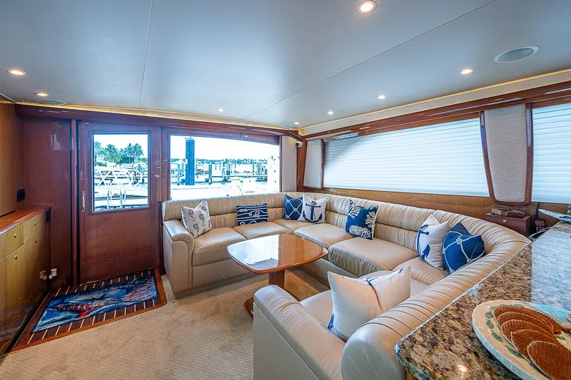 Slide: The Image of Luxurious interior of a 2003 Viking Convertible yacht with plush seating and nautical decor. - 28