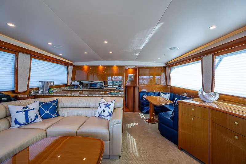 Slide: The Image of Luxurious interior of a 2003 Viking Convertible yacht with elegant seating and nautical decor. - 29