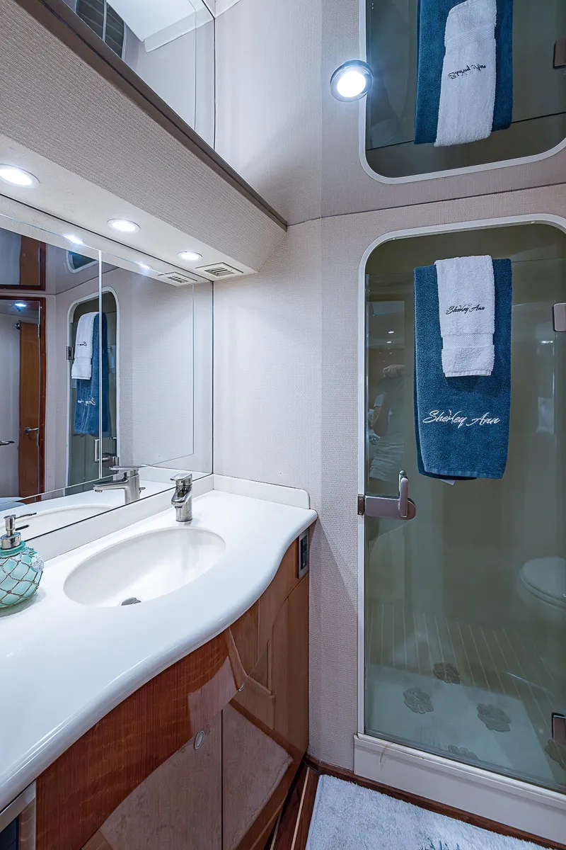 Slide: The Image of Luxurious bathroom in 2003 Viking Convertible yacht with modern fixtures and elegant design. - 37