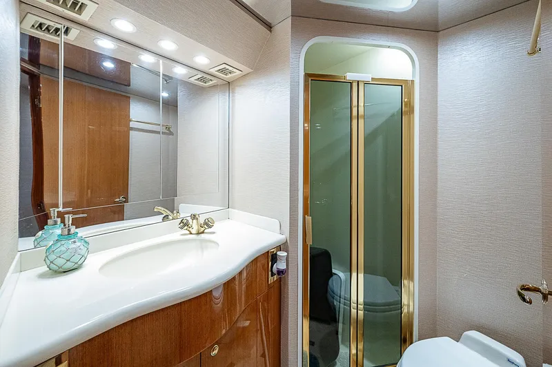 Slide: The Image of Luxurious bathroom in 2003 Viking Convertible yacht with elegant fixtures and shower. - 40