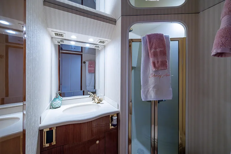 Slide: The Image of Luxurious bathroom in a 2003 Viking Convertible yacht with elegant fixtures and shower. - 42