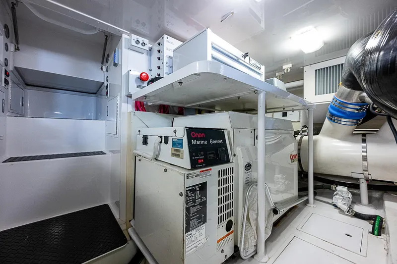 Slide: The Image of Engine room of a 2003 Viking Convertible yacht with Onan marine generator. - 44
