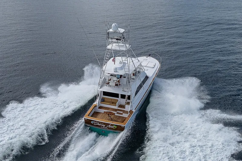 Slide: The Image of 2003 Viking Convertible yacht cruising on open water, aerial view. - 46