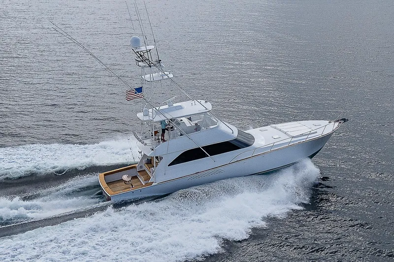 Slide: The Image of 2003 Viking Convertible yacht cruising on open water, displaying sleek design and powerful performance. - 47