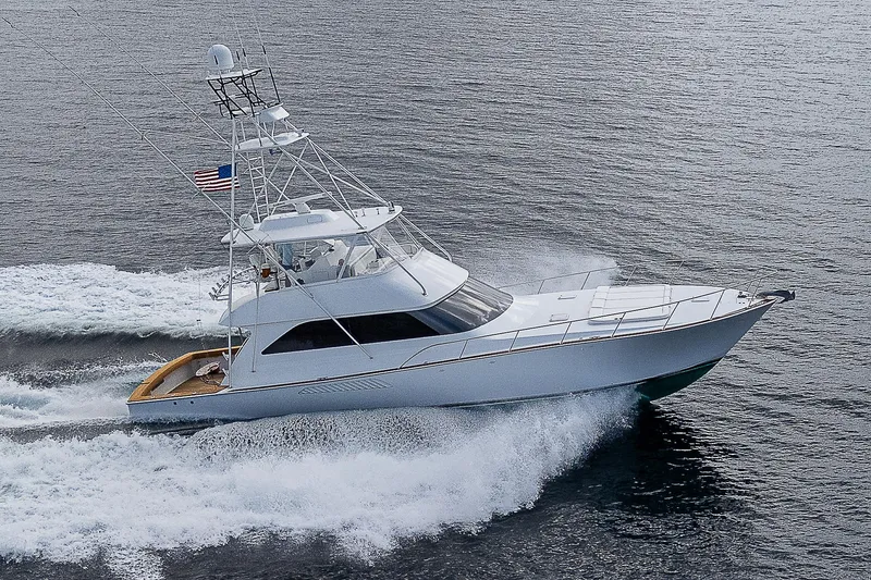 Slide: The Image of 2003 Viking Convertible yacht cruising on open water, displaying sleek design and powerful performance. - 48