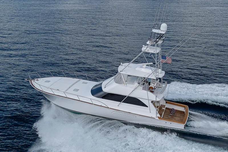 Slide: The Image of 2003 Viking Convertible yacht cruising on open water, aerial view. - 49