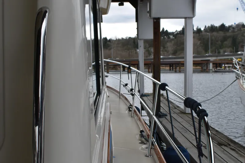 Slide: The Image of 2011 Sabre 42 Salon Express docked, showcasing sleek starboard side desk - 10
