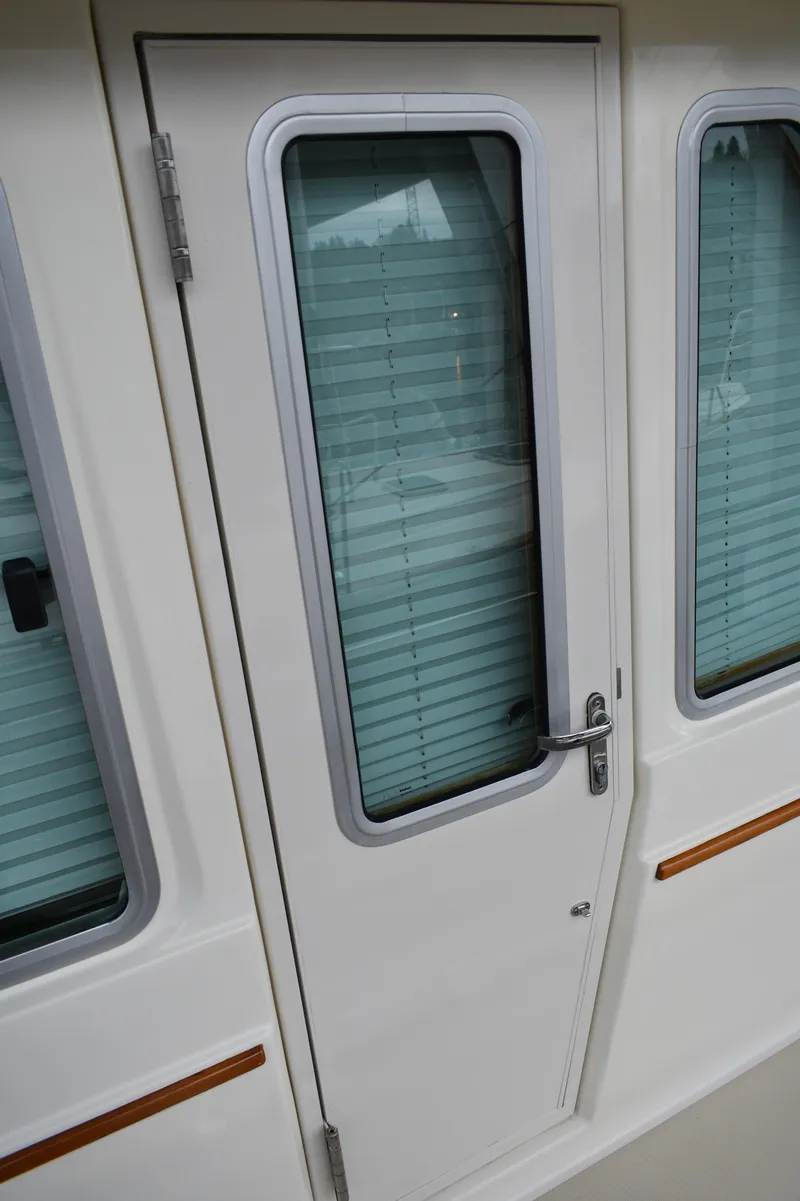 Slide: The Image of 2011 Sabre 42 Salon Express door with windows and blinds. - 11