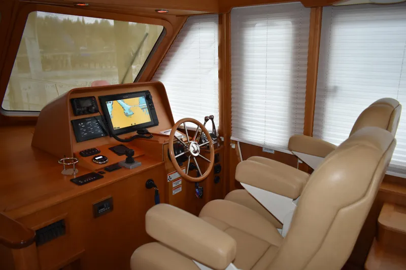 Slide: The Image of Interior helm of 2011 Sabre 42 Salon Express with navigation equipment and twin Stidd chairs - 17